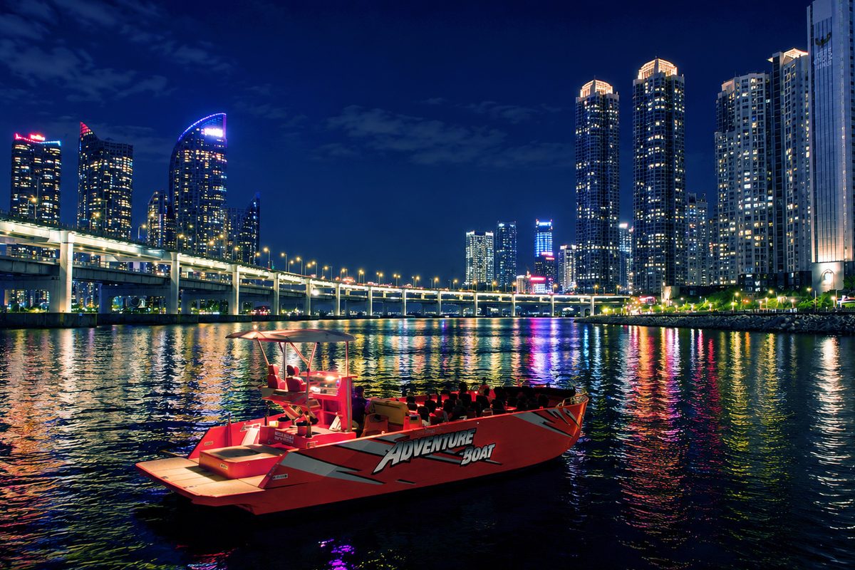 Boat running across the night sea