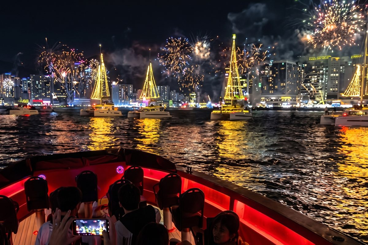 Night boat watching the yacht tree and fireworks