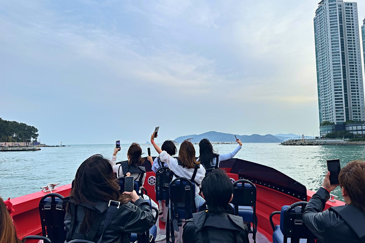 Guests waving from the boat