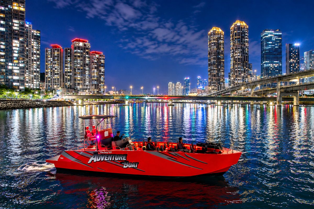 Adventure Night boat running past the Marine City skyline at night
