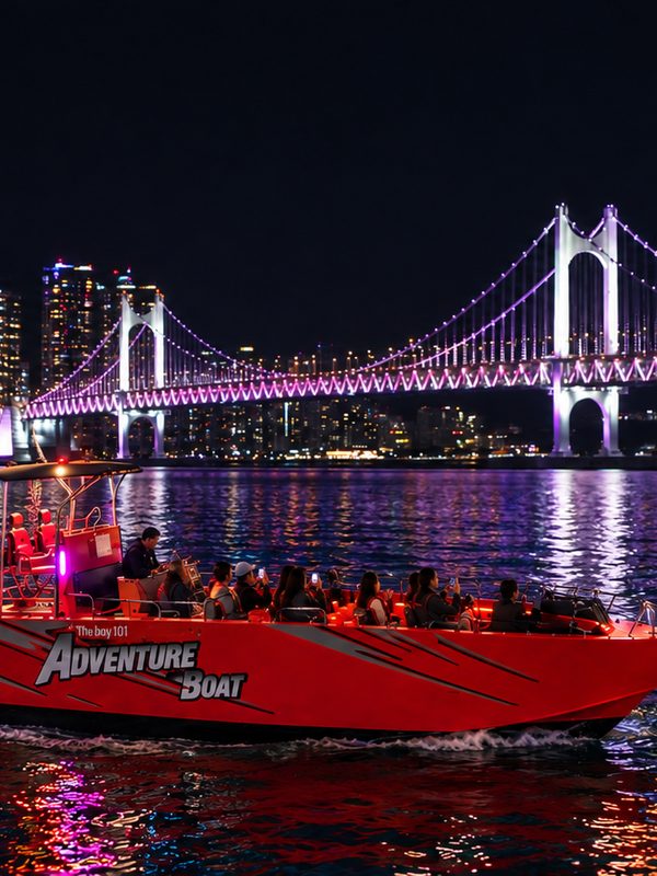Guests on the boat amid the night lights