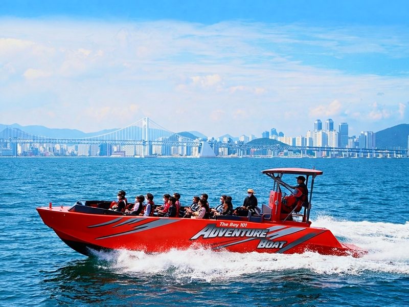 Adventure boat kicking up white spray