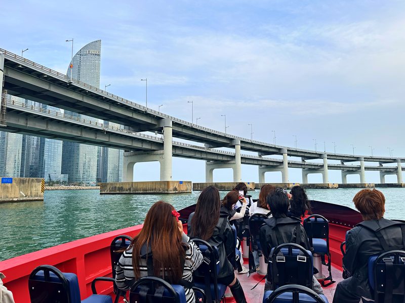 Guests on the boat looking at Gwangan Bridge