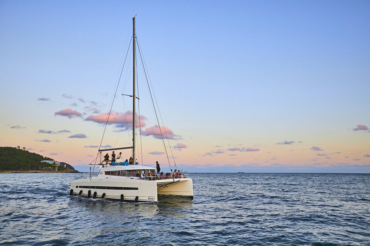 The BALI yacht on the sea at sunset