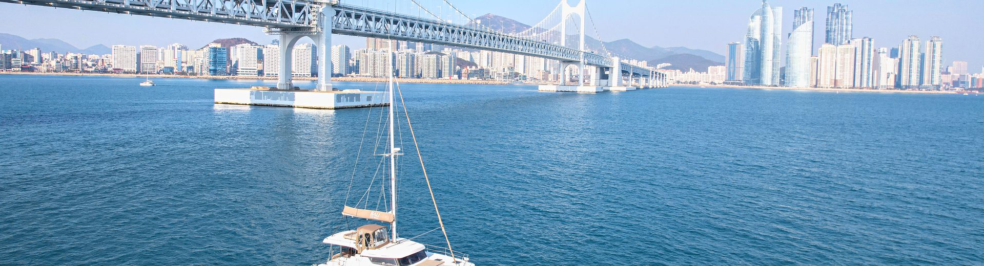 Yacht passing in front of Gwangan Bridge
