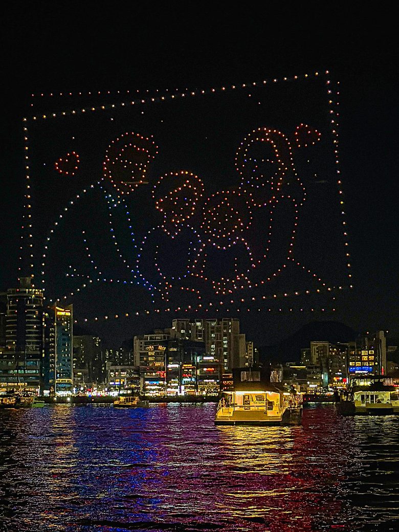 A figure in a frame drawn with drones