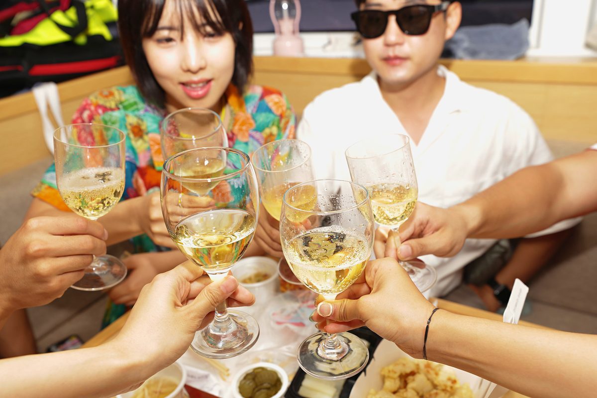 A group raising a toast on the yacht
